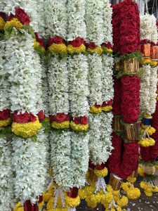 Jasmine, rose and marygold garlands for sale. An early morning view from KR Market, Bengaluru, Karnataka.