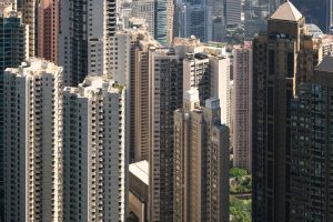 The frame is filled with tall, mostly, residential buildings. The tops of the foreground buildings are visible, but the ones further back fill the frame top to bottom.