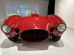 Sleek small red race car, one seat, seen from the front. National Museum of the Automobile, Torino, Italy