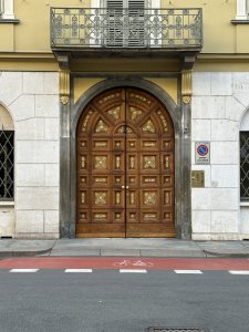 Large wooden door on a Torino street, Italy.