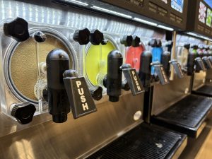 An array of frozen beverage dispensers.