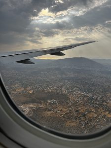 View larger photo: Athens Greece as viewed through a plane window. Sun beaming through clouds