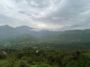 View larger photo: Malshej Ghat is a mountain pass in India's Maharashtra state that is part of the Western Ghats Range. Long view of a green valley.