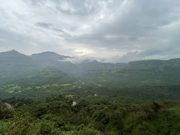 Malshej Ghat is a mountain pass in India’s Maharashtra state that is part of the Western Ghats Range. Long view of a green valley.