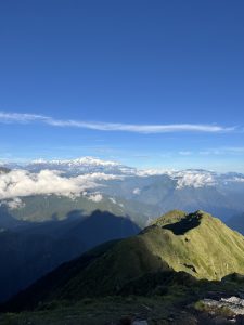 View larger photo: A beautiful mountain landscape with clouds between the mountain tops.