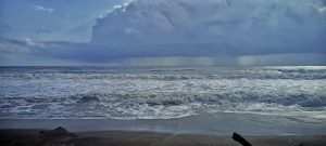 Beach,raining far in the sea