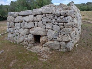  View of the south naveta at Rafal Rubi talaiotic site. Neolithic stone house.