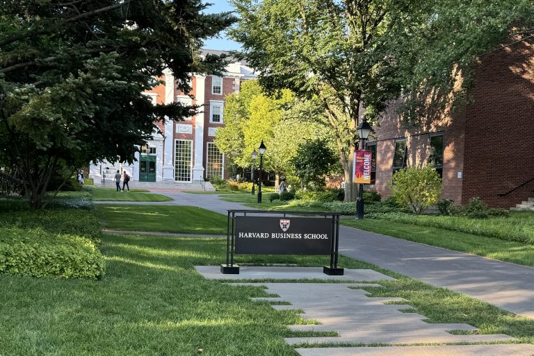 The entrance of the Harvard Business School at Cambridge, Massachusetts, with the Harvard Business School visible, and the Baker Library behind it.