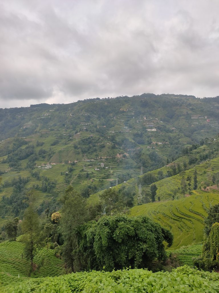 Long view across green hills with homes scattered about on Kakani – Near Kathmandu