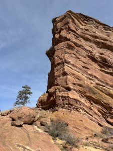 View larger photo: Rock formation in Denver, Colorado, with many horizontal layers of rock visible.