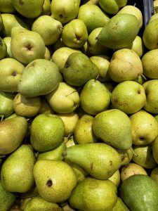 View larger photo: A large pile of fresh, green pears.