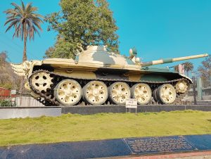 Strength and serenity: an army tank standing tall in the park.