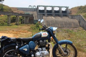 A motorcycle near a dam.