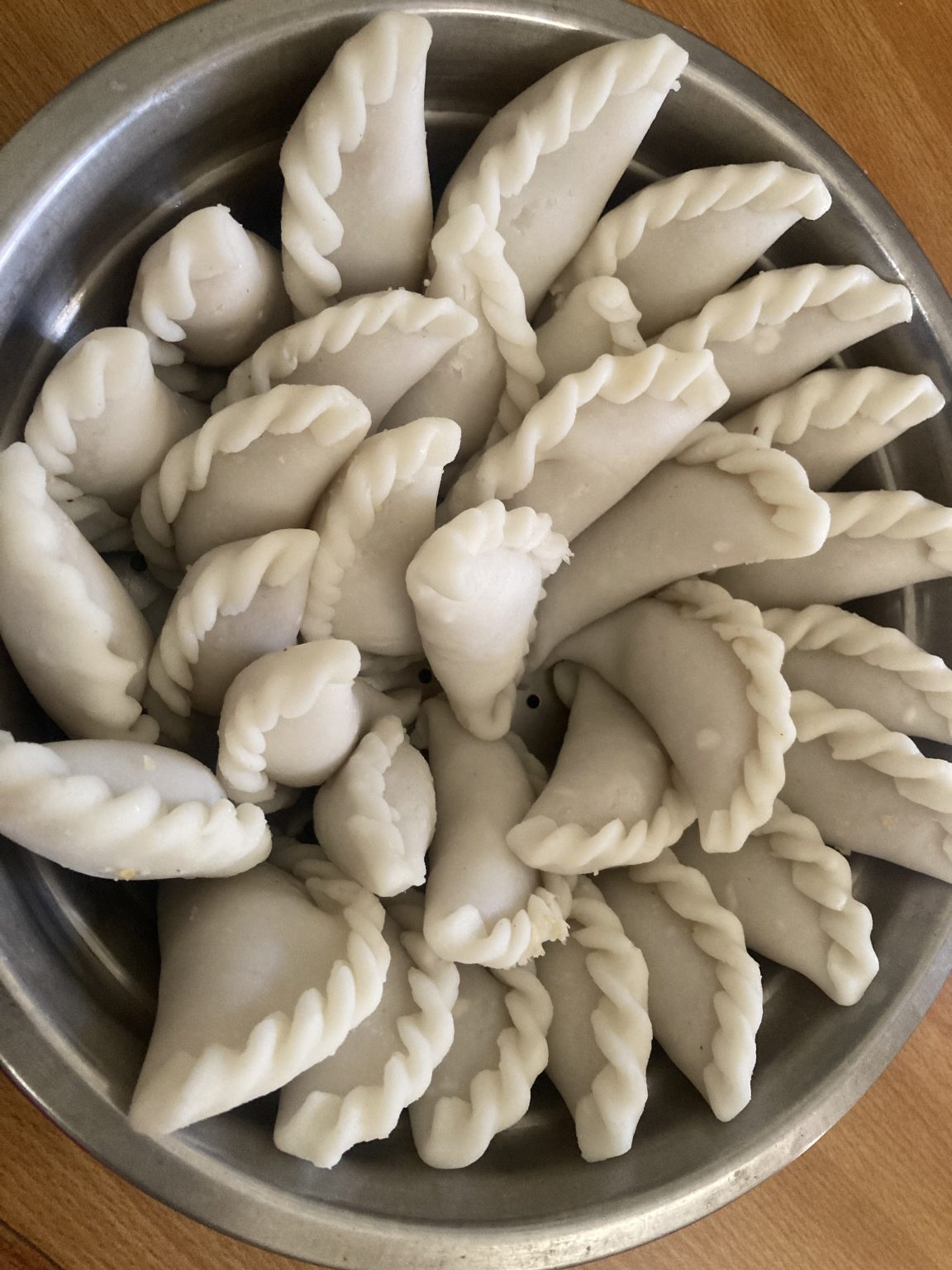 Kudumu in Telugu, Kadubu in Kannada. A steamed sweet dish served with coconut milk during Ganesha Festival
