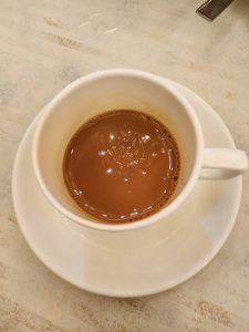 View larger photo: Tea cup and saucer filled with tea