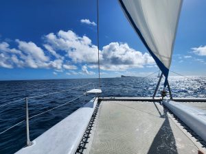 View larger photo: The Catamaran sailing thru gusty wind and high waves.