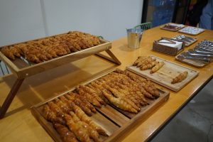 View larger photo: Freshly baked mini-croissants on a buffet table at a social event