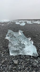 Melting ice from the J?kulsárlón Glacier scattered amongst other melting ice chunks on Diamond Beach, Iceland