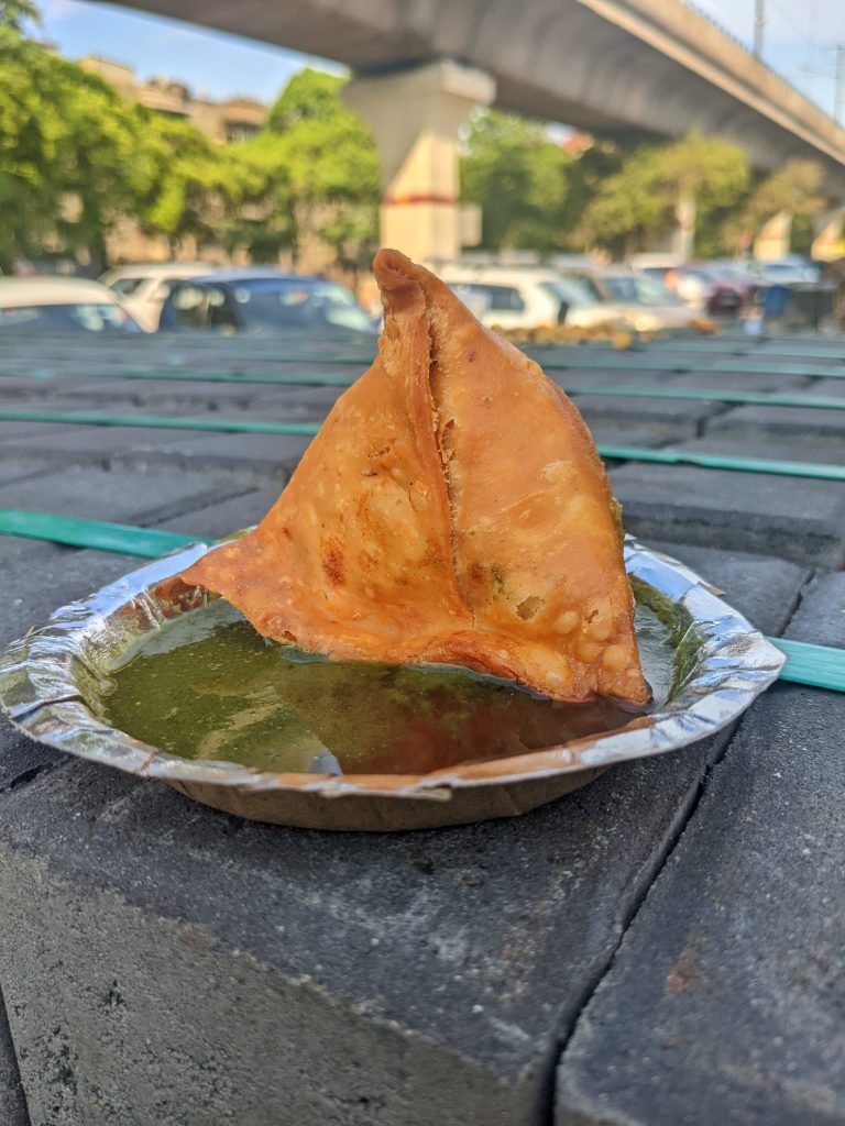 Samosha in a Plate with red and green sauce