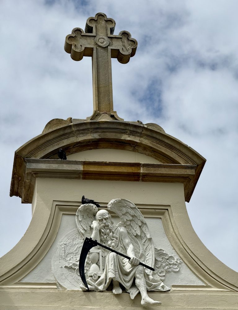 Angel of death marble sculpture looms over Bogotá’s central cemetery gate like a perpetual memento mori for all visitors.