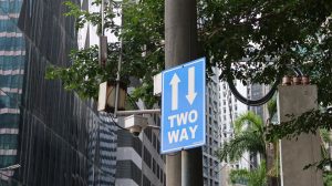 a sign that reads Two Way with directional arrows pointing up and down