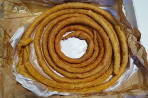 View larger photo: Full wheel of Spanish churros sitting on a table at a WordPress event