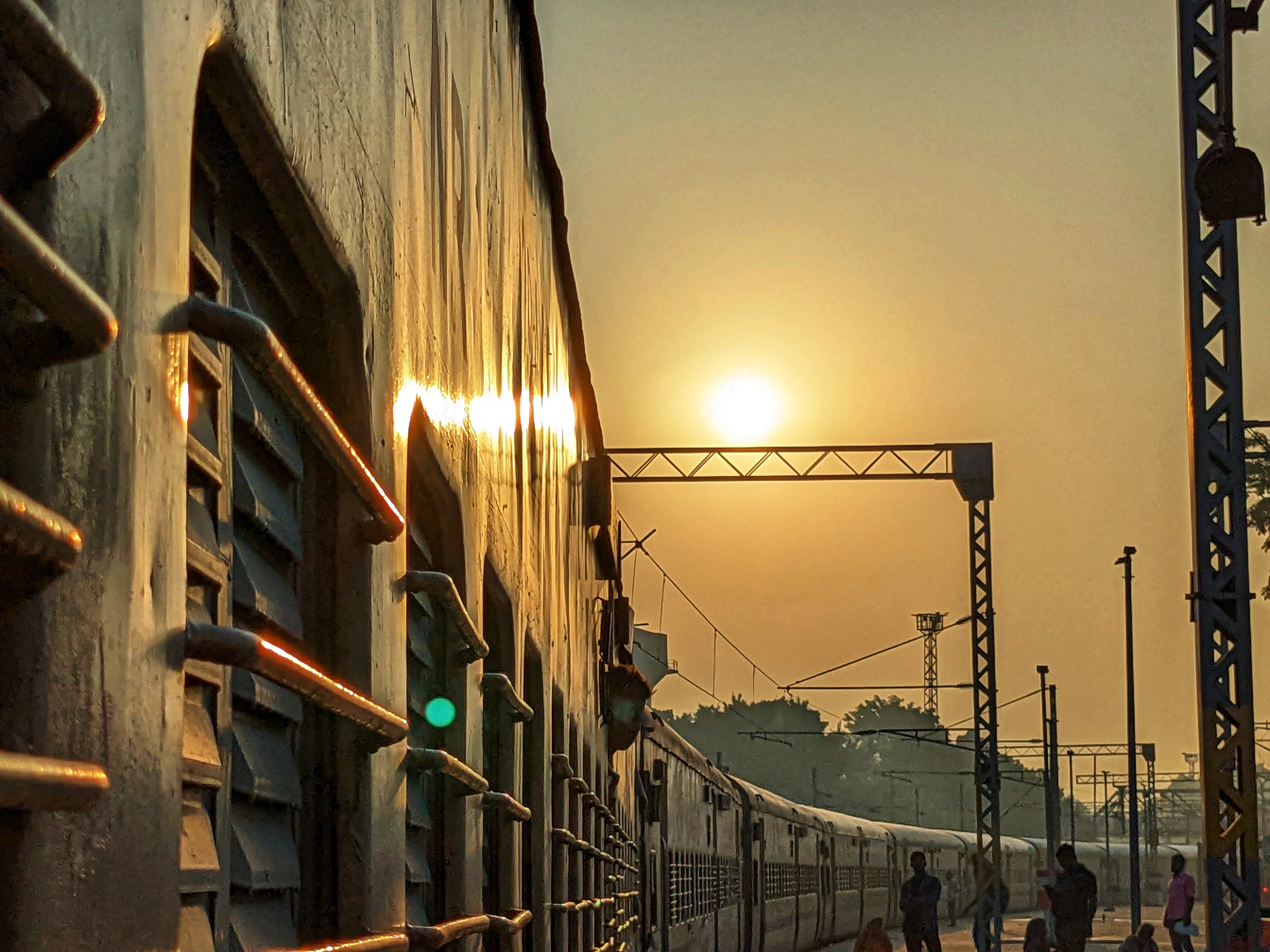 Sunrise at Railway Satiation with running Train
