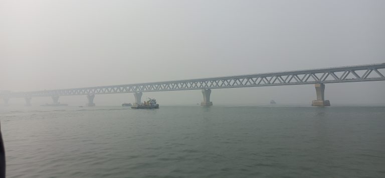 A place where fog, river, and bridge melt together at Mawa Ghat.