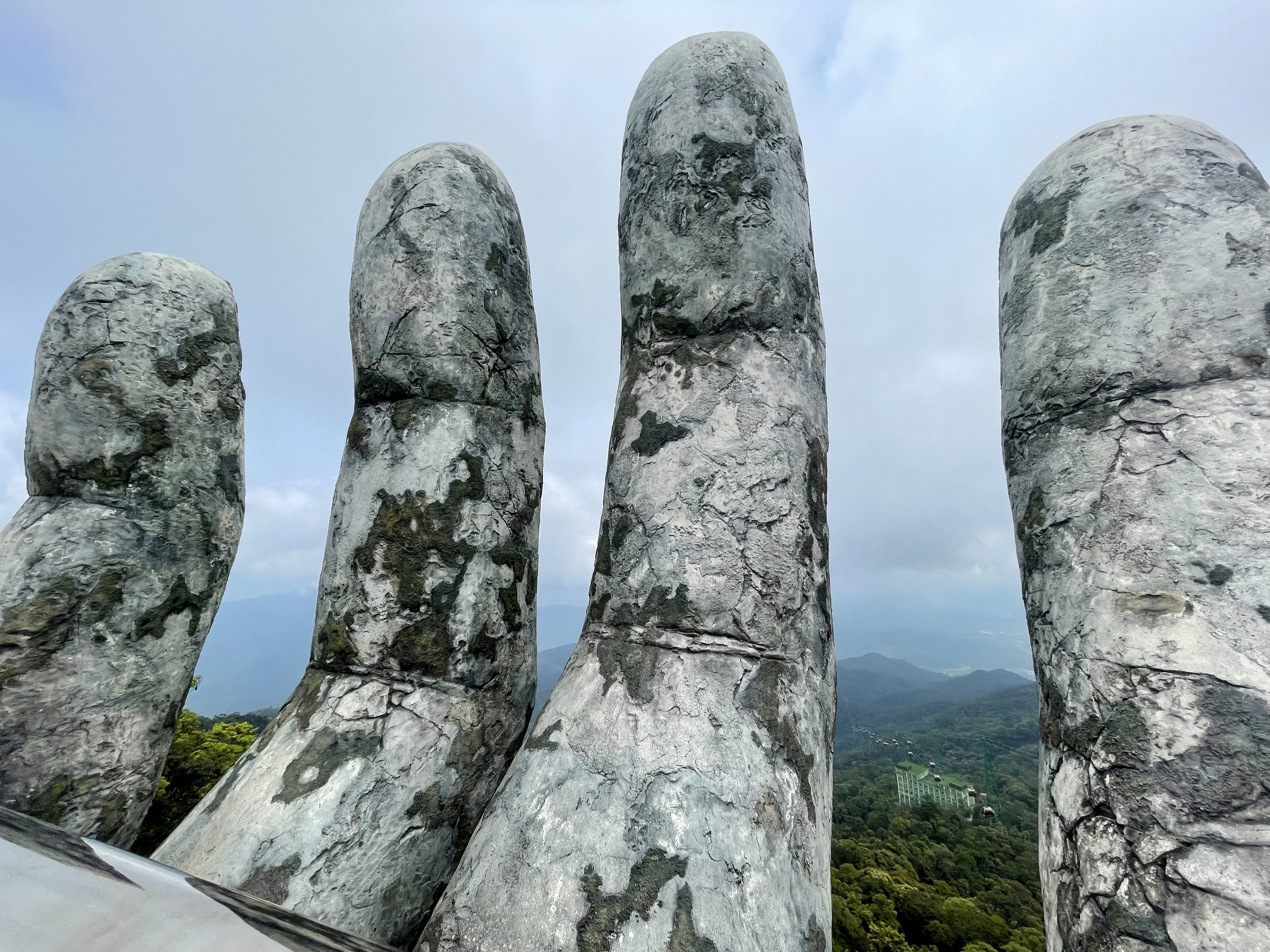 Rocky fingers of goldern bridge in bà nà hills in da nang, vietnam.