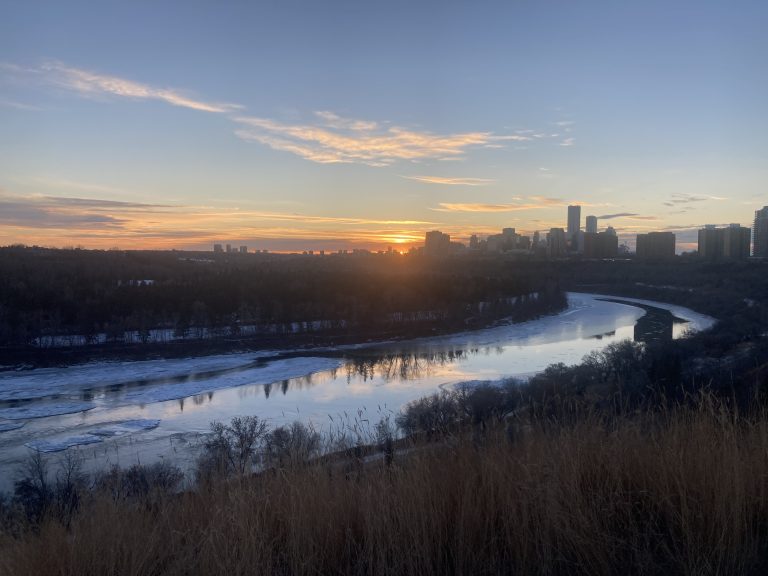 North Saskatchewan River in winter, facing downtown along the north bank.