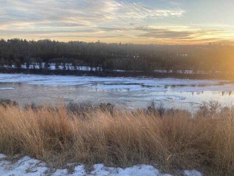 North Saskatchewan River and Edmonton evening skyline in winter.