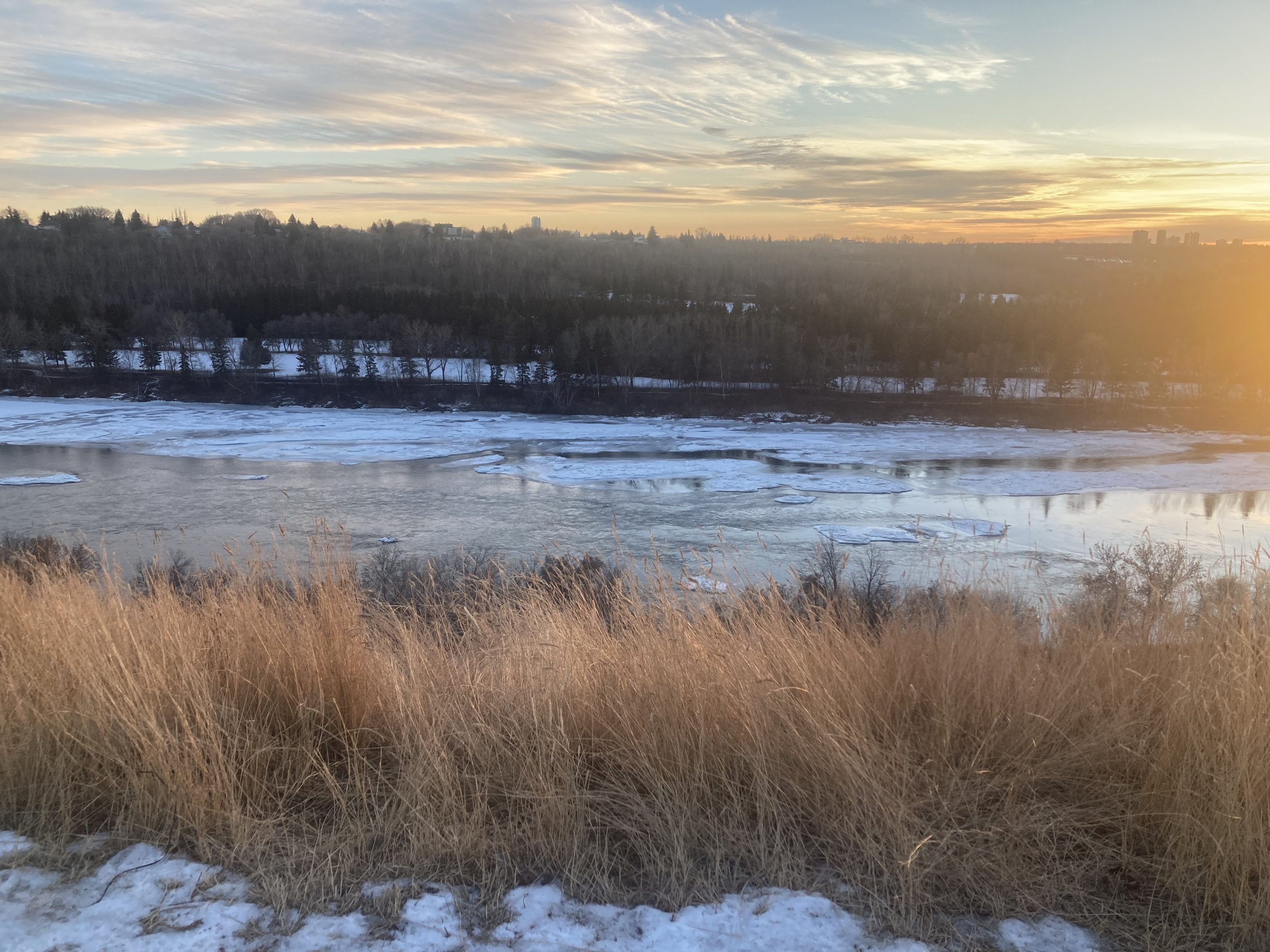 North Saskatchewan River and Edmonton evening skyline in winter. 