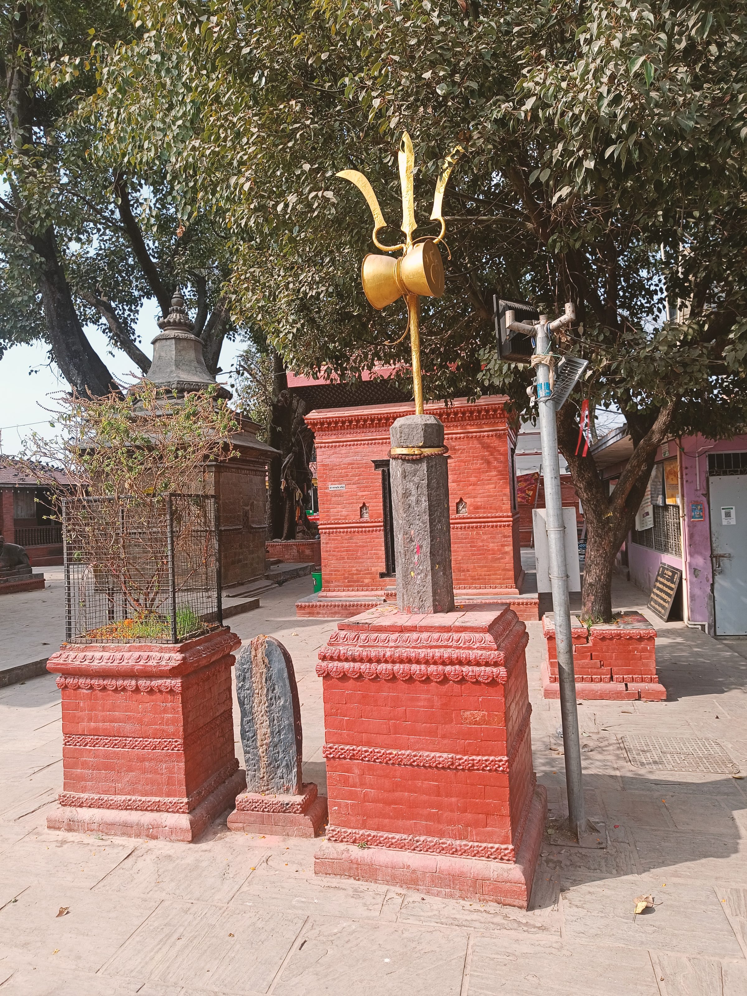 Tridents and drum of Lord Shiva. Trident represent the three powers, knowledge, desire and implementation. While we can hear the sound from the drum.