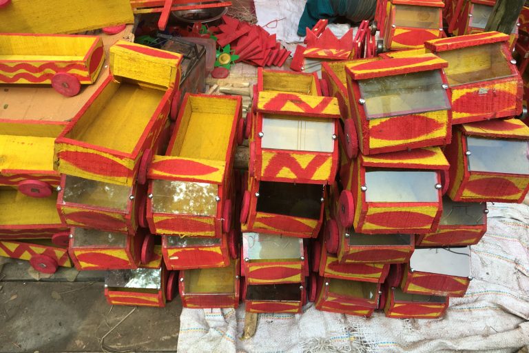 Traditional Bangladeshi toy truck handcrafted from wood, showcasing cultural artistry.