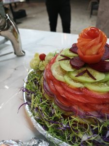 Decorative salad of vegetables including tomato, cucumber, onion and beet