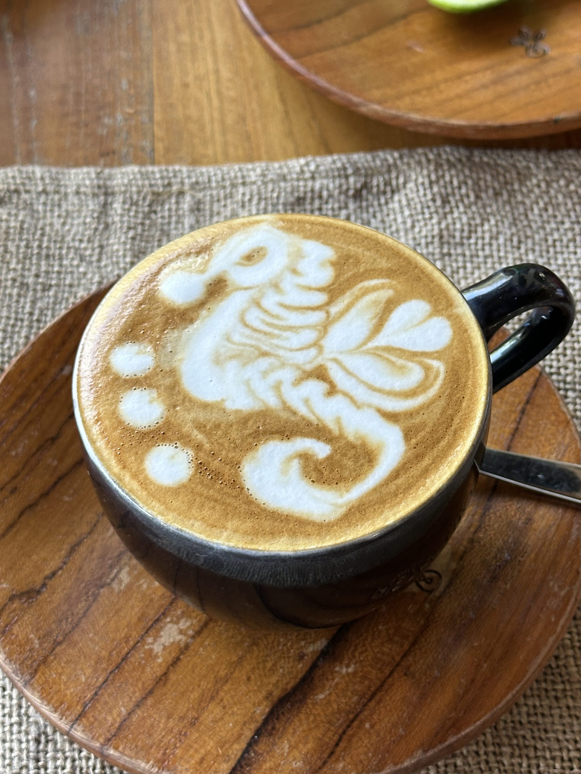 Fresh Coffee in a cup. Seahorse artwork created by barista.