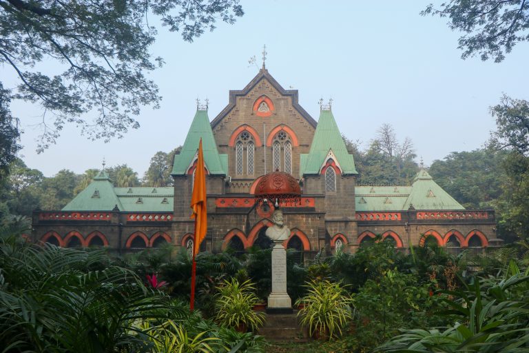 Kolhapur Town Hall stands as a magnificent example of Neo-Gothic architecture, surrounded by lush greenery and adorned with historical charm.