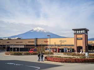 A shopping mall building in Japan with Mount Fuji in the background