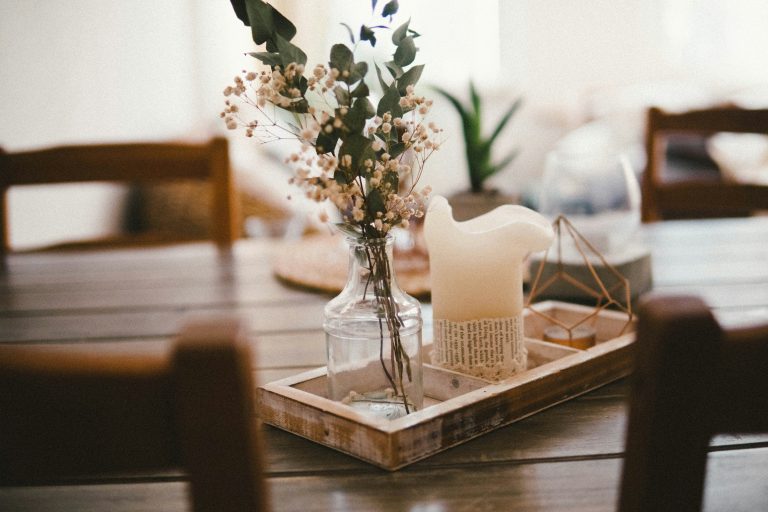 Flowers with a candle on the dining table