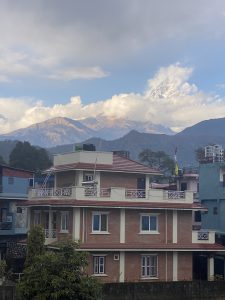 A lovely house with Mount Fishtail towering in the background.