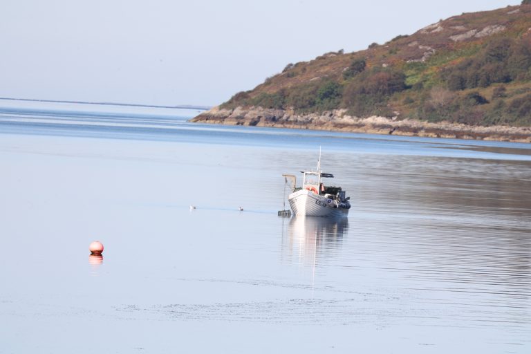 Small fishing boat on Loch Broom, Scottish Highlands