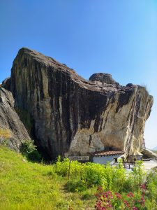  A large rock formation known as Mahashila, the biggest stone located in Parbat, showcasing its impressive size and structure.