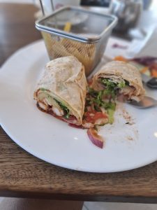 Chicken barbeque roll served with fries
