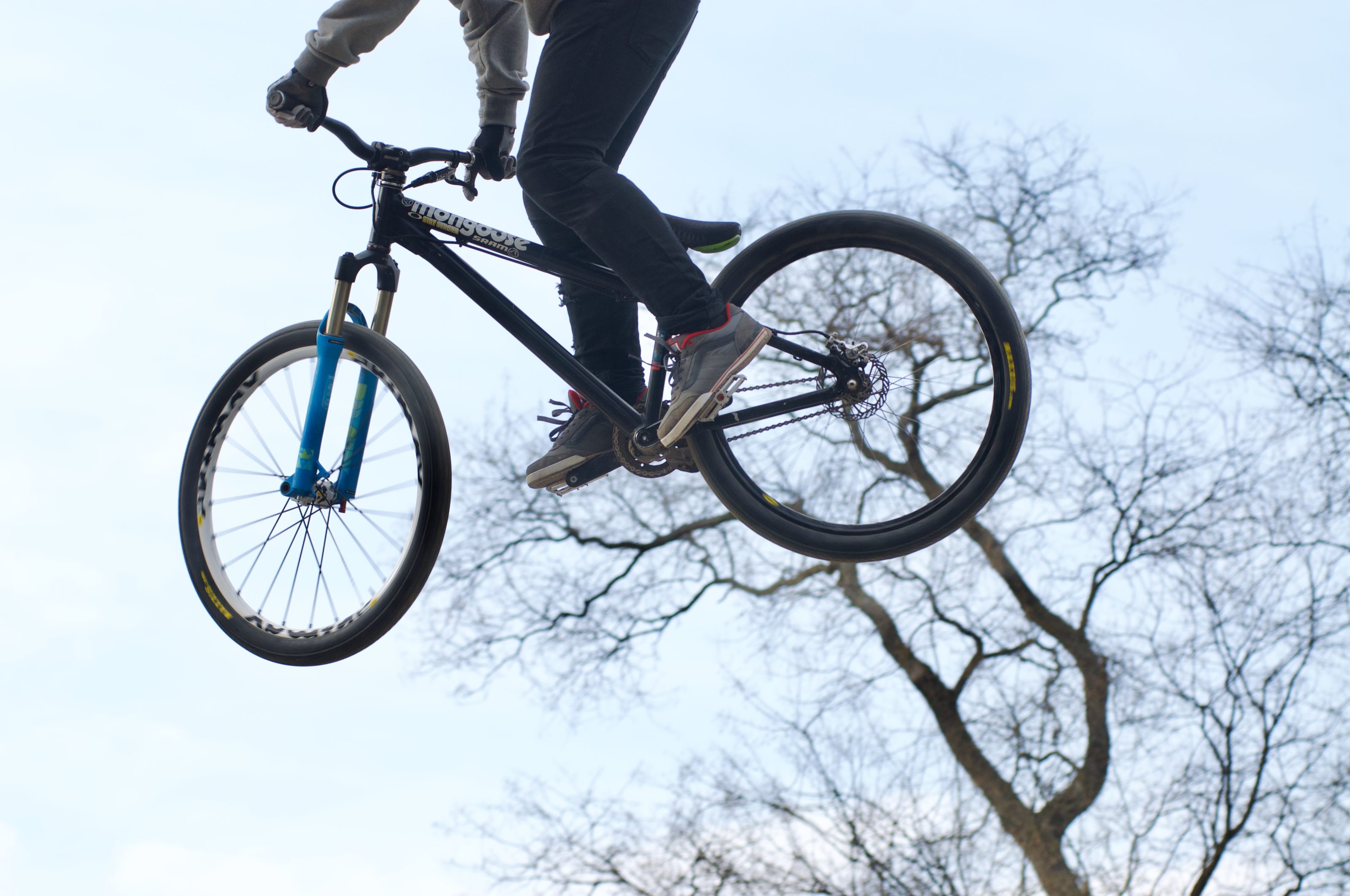 A rider performing tricks in a bmx competition.