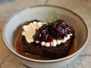 Banana cake with Cherry jam & Vanilla cream as toppings. 