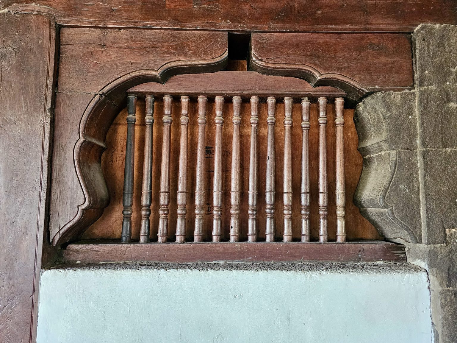 An example of the detailed wooden carvings found within Shaniwar Wada, a historic fort in Pune.