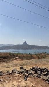 A vibrant blue sky devoid of clouds, showcasing the peaceful ambiance of Pawna Camp in Pune