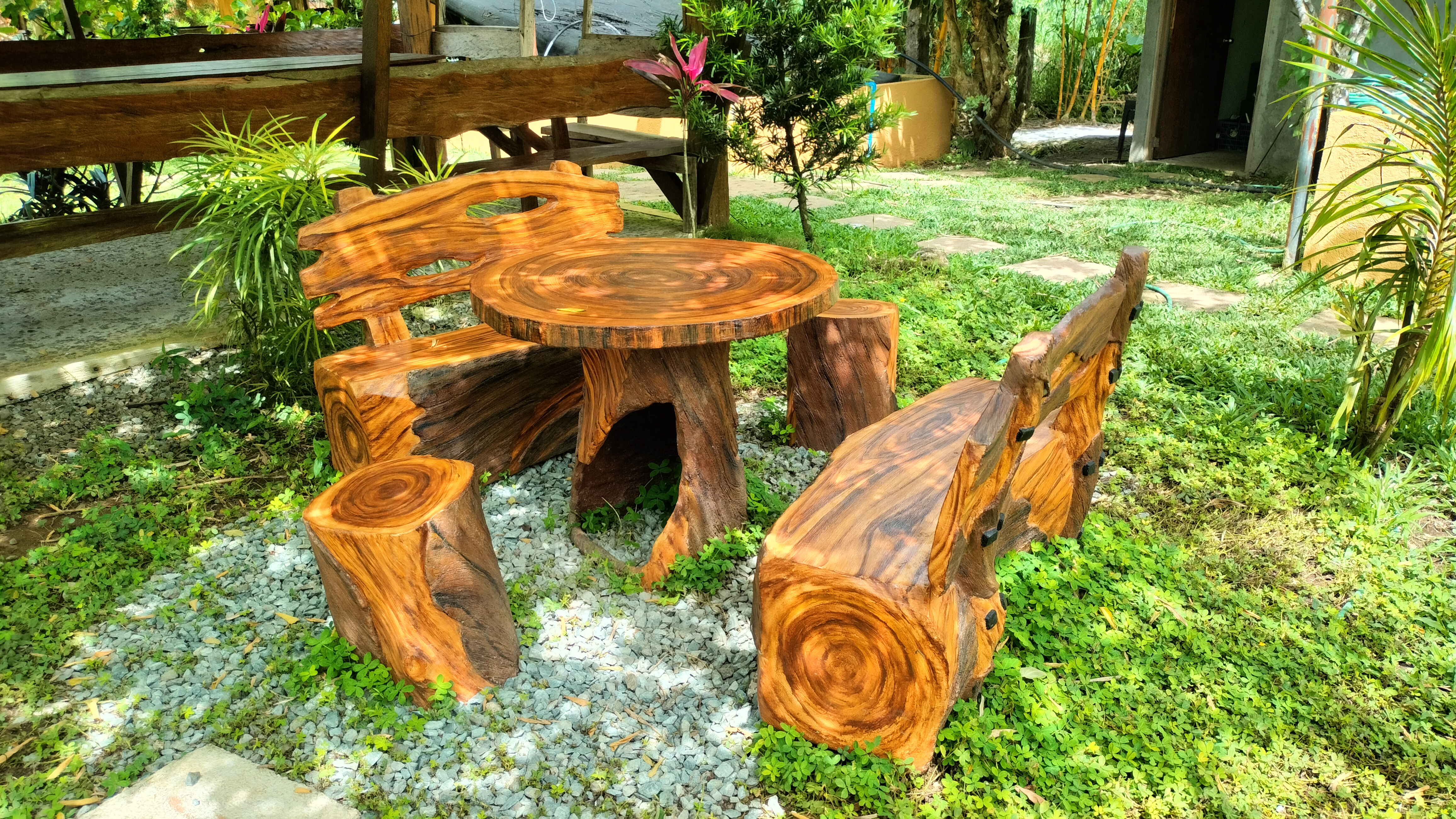 A beautifully crafted wooden seating arrangement, blending seamlessly with the natural surroundings for a perfect outdoor retreat.