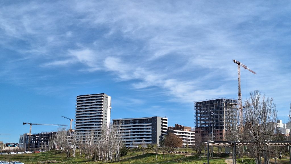 Buildings under construction with cranes