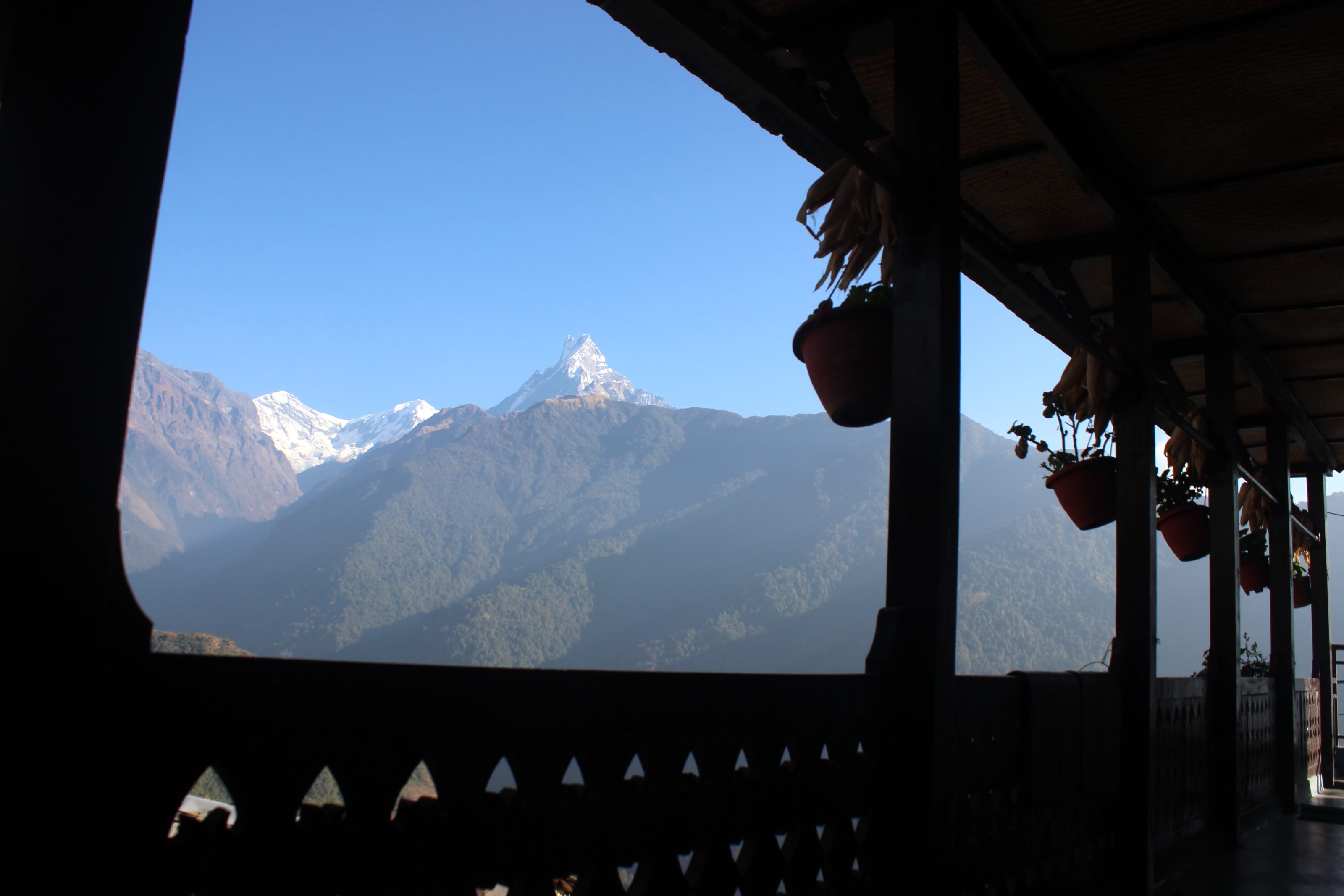 Typical house and and Mt Macchapucre on back.